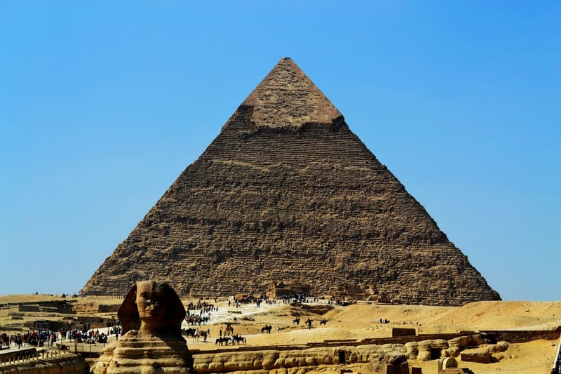 The Great Sphinx of Giza with a pyramid behind, Egypt