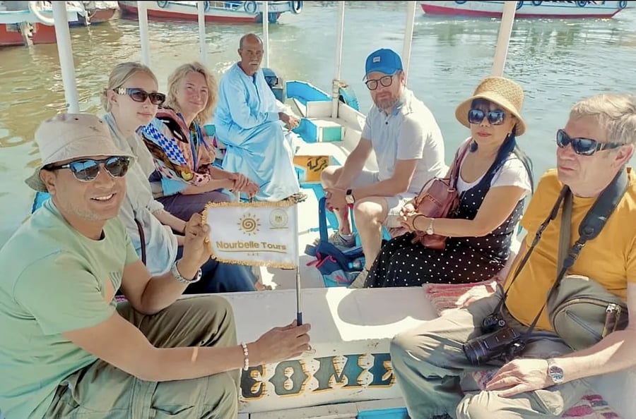Partner group on a private Nile boat with the Nourbelle flag