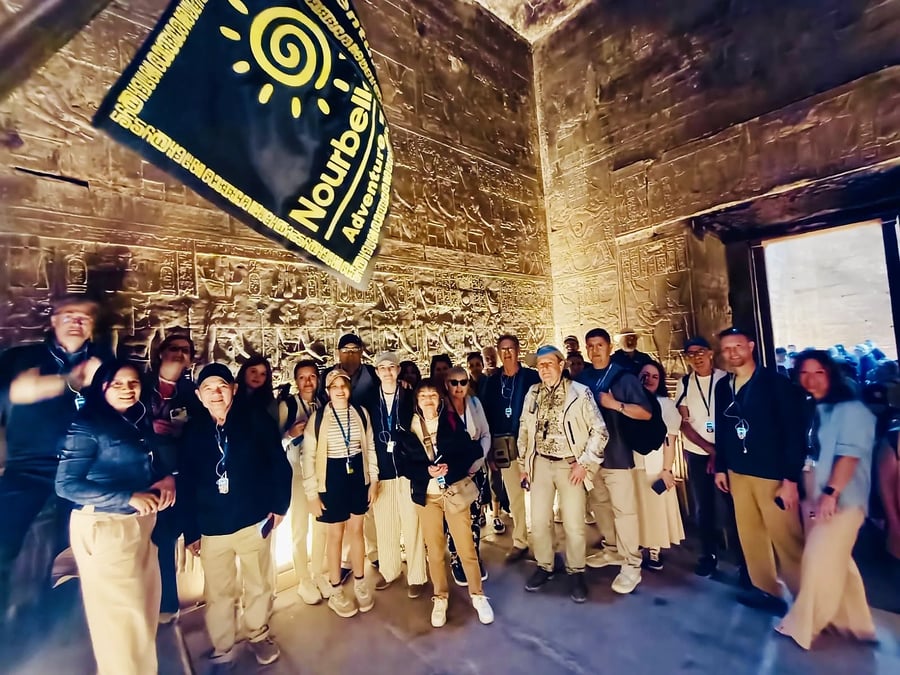 Partner group inside Edfu Temple with the Nourbelle flag