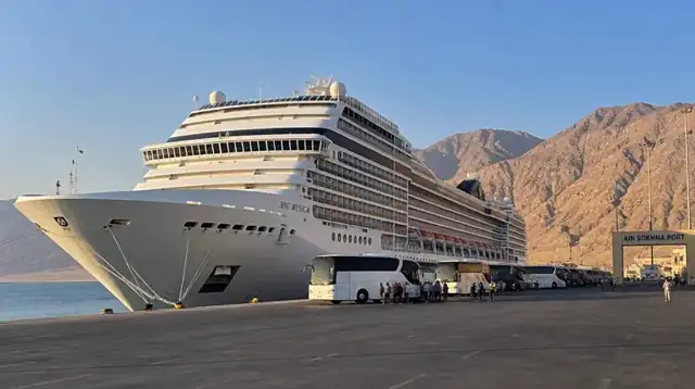 Cruise ship docked at Ain Sokhna with coaches on the quay